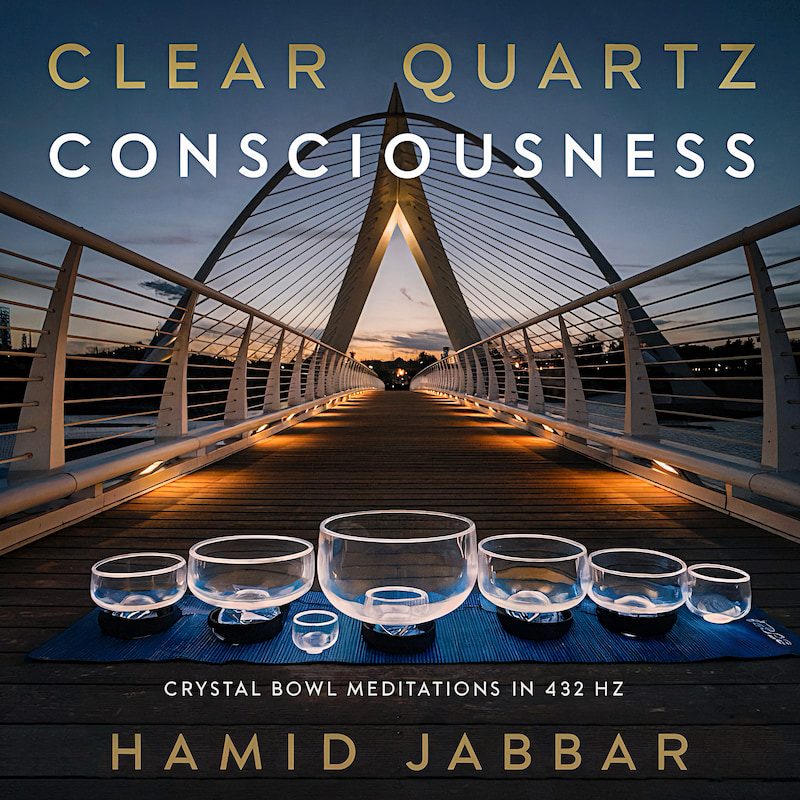Cover art for Clear Quartz Consciousness, a row of clear crystal singing bowls on a blue mat on a lit pedestrian bridge at dusk